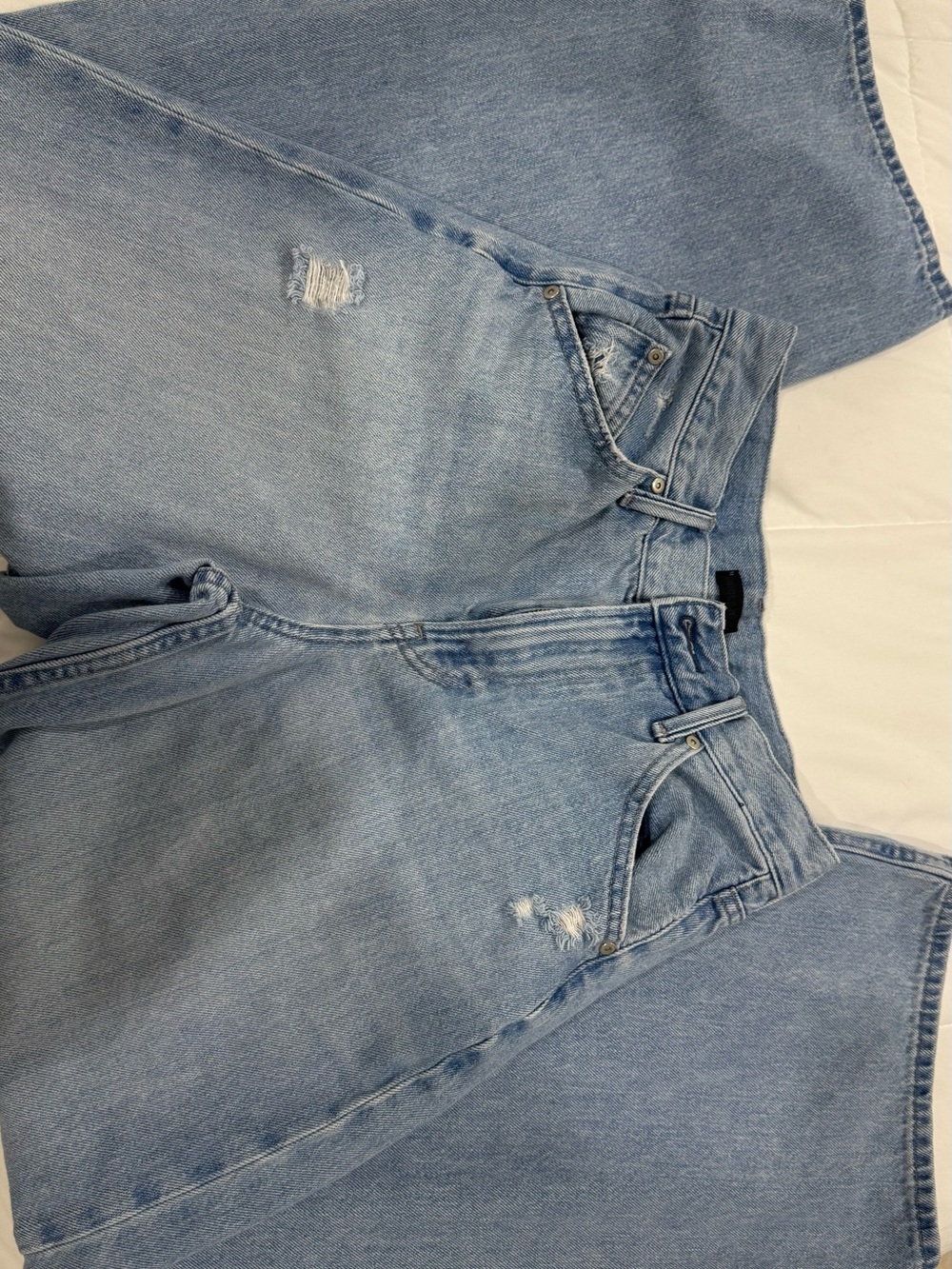Uniqlo Light Blue Flare Jeans with Subtle Distressing
